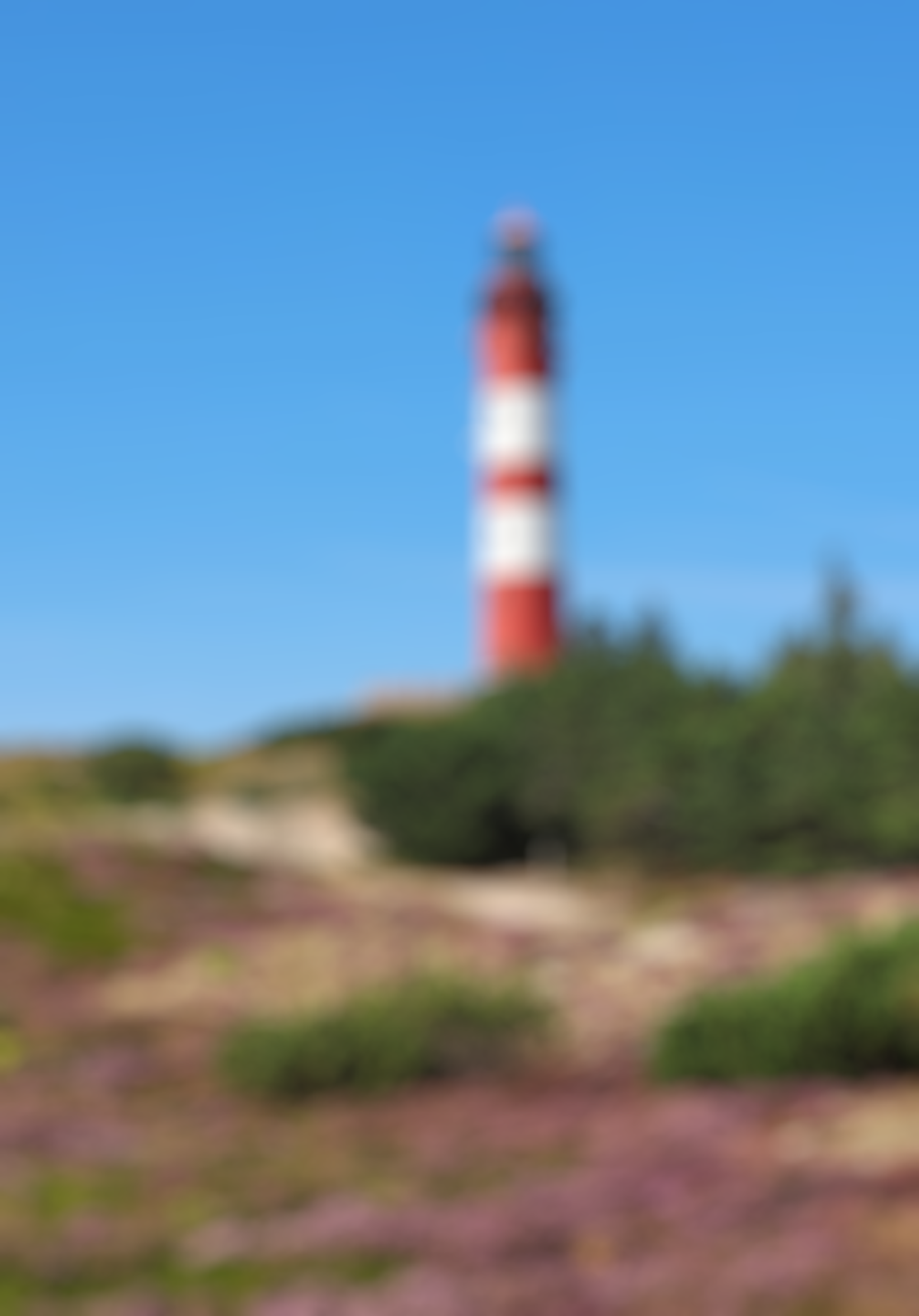 A blurred image of the Amrumer lighthouse